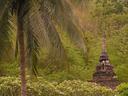 Ancient stupas also stand outside, near the cave entrance.